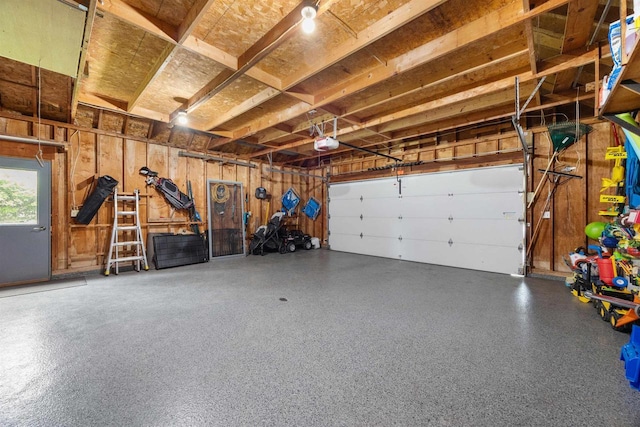 1341 Fieldstone Ct, Neenah, WI 54956 - garage featuring a garage door opener