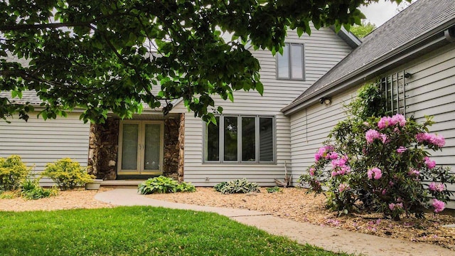 1341 Fieldstone Ct, Neenah, WI 54956 - view of exterior entry featuring roof with shingles