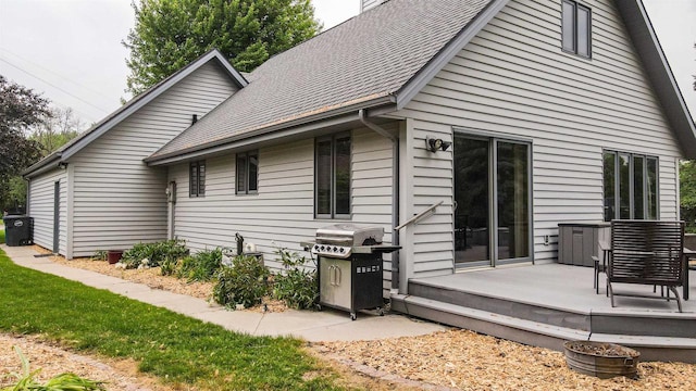 1341 Fieldstone Ct, Neenah, WI 54956 - back of house with a shingled roof and a wooden deck