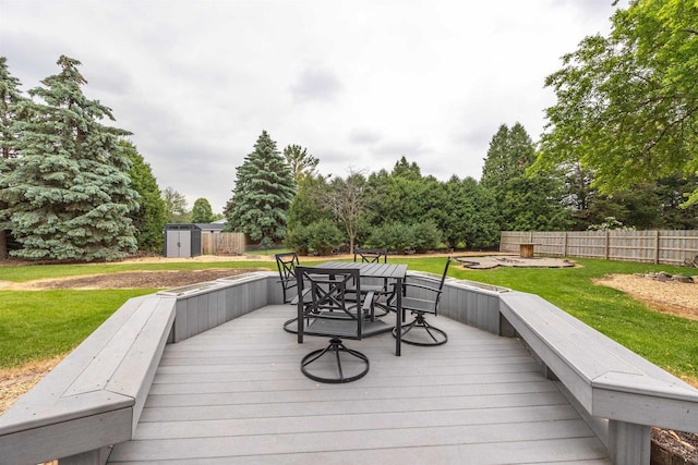1341 Fieldstone Ct, Neenah, WI 54956 - deck with outdoor dining area and a storage shed