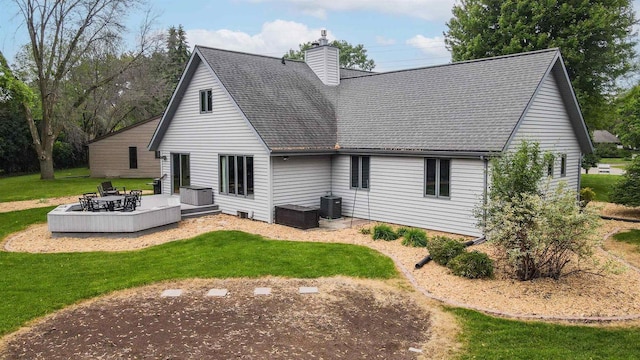 1341 Fieldstone Ct, Neenah, WI 54956 - back of property with a yard, a chimney, roof with shingles, an outdoor fire pit, and a deck