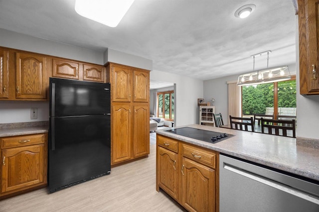 1341 Fieldstone Ct, Neenah, WI 54956 - kitchen featuring black appliances, brown cabinets, and light wood finished floors
