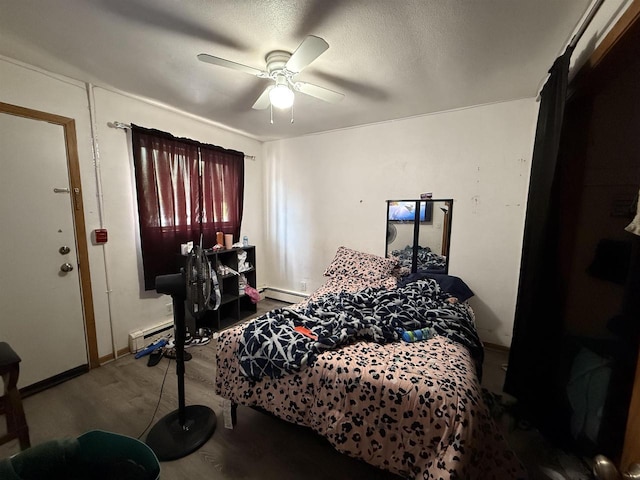 2342 Allied Dr Unit 1, Madison, WI 53711 - bedroom with wood finished floors, a baseboard heating unit, and ceiling fan