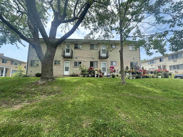 2342 Allied Dr Unit 2, Madison, WI 53711 - rear view of house featuring a yard and stone siding