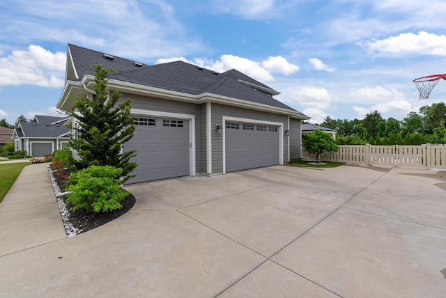 7845 W Mourning Dove Ln, Mequon, WI 53097 - view of side of home with driveway and roof with shingles