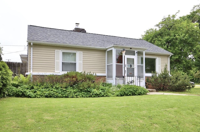 3315 E Allerton Ave, Cudahy, WI 53110 - view of front facade with a chimney, a front yard, roof with shingles, and brick siding