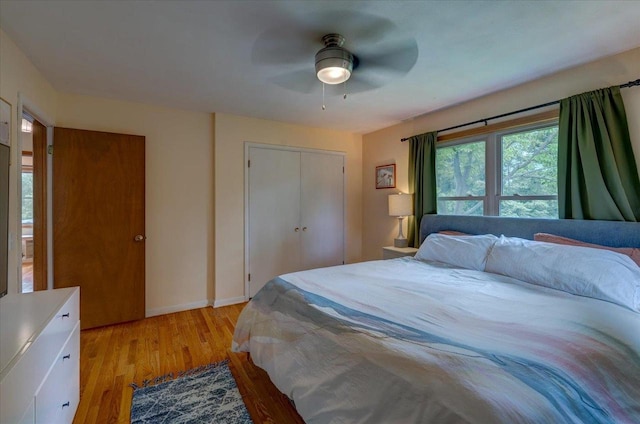 5043 Marathon Dr, Madison, WI 53705 - bedroom featuring light wood-style floors, a closet, and a ceiling fan