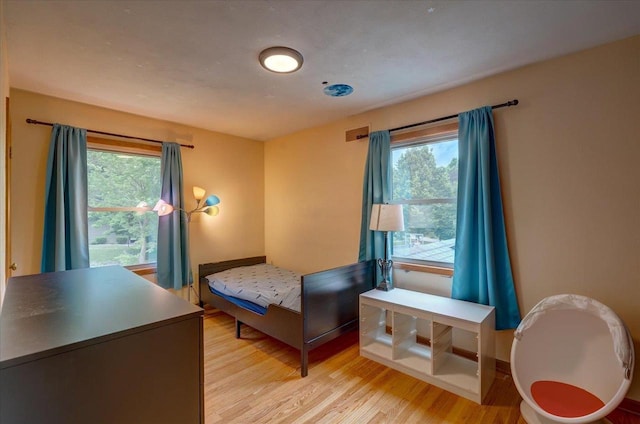 5043 Marathon Dr, Madison, WI 53705 - bedroom featuring light wood finished floors and multiple windows