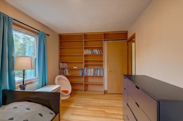 5043 Marathon Dr, Madison, WI 53705 - bedroom featuring multiple windows and light wood-style floors