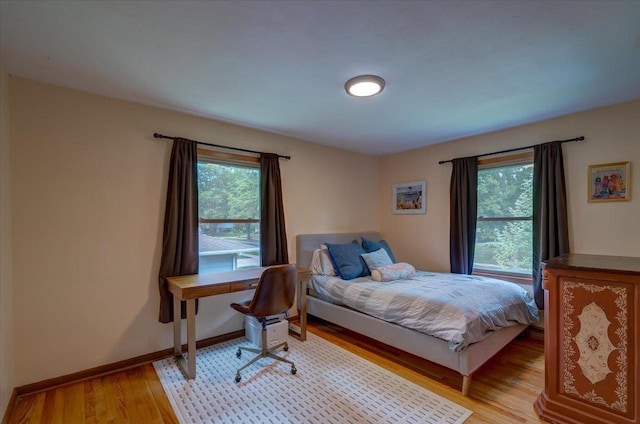 5043 Marathon Dr, Madison, WI 53705 - bedroom with wood finished floors and multiple windows