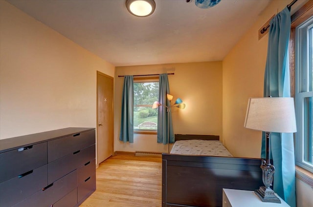 5043 Marathon Dr, Madison, WI 53705 - bedroom with light wood-style flooring and baseboards