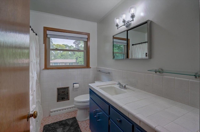 5043 Marathon Dr, Madison, WI 53705 - bathroom featuring a baseboard radiator, vanity, crown molding, tile walls, and tile patterned flooring