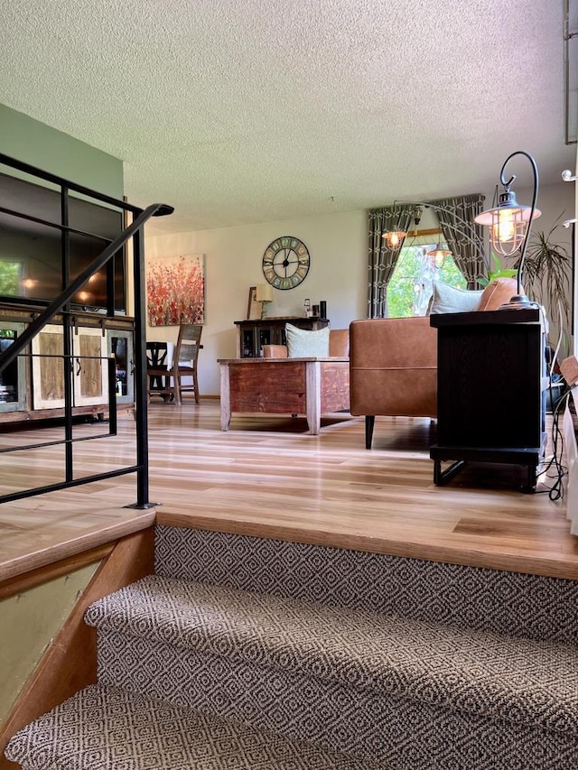 5116 S 84th St, Greendale, WI 53129 - stairs featuring wood finished floors and a textured ceiling