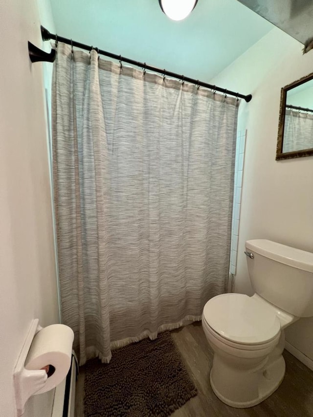 5116 S 84th St, Greendale, WI 53129 - bathroom featuring wood finished floors and curtained shower