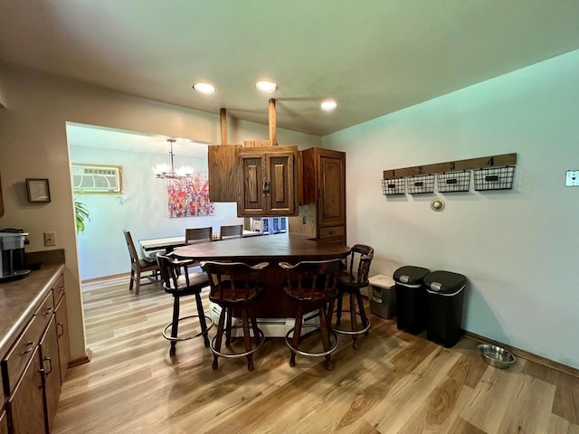 5116 S 84th St, Greendale, WI 53129 - dining room with a wall unit AC, light wood-style floors, a chandelier, and recessed lighting