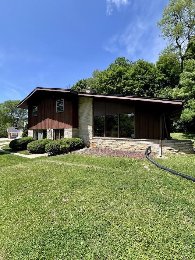 5116 S 84th St, Greendale, WI 53129 - view of property exterior featuring a yard
