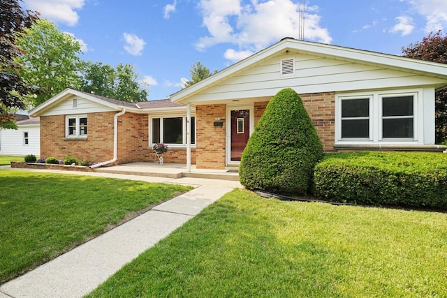 324 E Market St, Burlington, WI 53105 - single story home featuring brick siding and a front yard