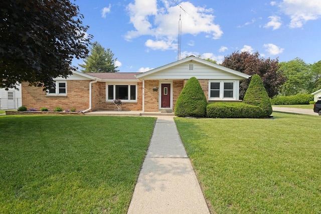 324 E Market St, Burlington, WI 53105 - ranch-style home with a front yard and brick siding