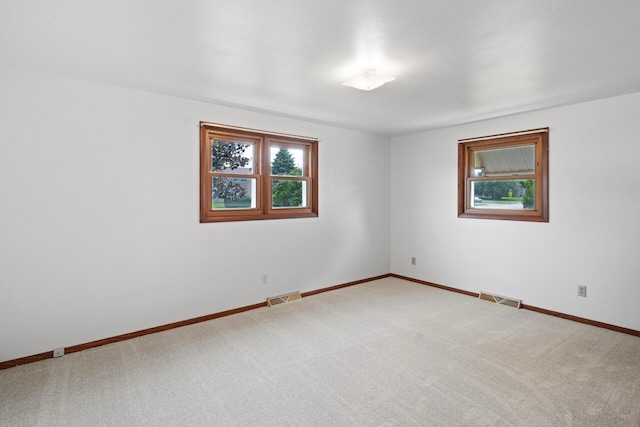 324 E Market St, Burlington, WI 53105 - empty room featuring carpet floors and baseboards