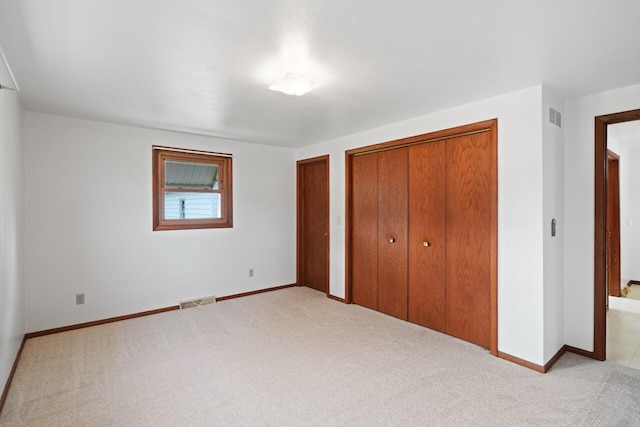 324 E Market St, Burlington, WI 53105 - unfurnished bedroom with carpet floors and multiple closets