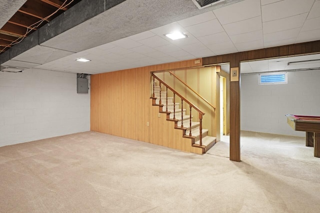 324 E Market St, Burlington, WI 53105 - basement with carpet floors, stairs, concrete block wall, wooden walls, and electric panel
