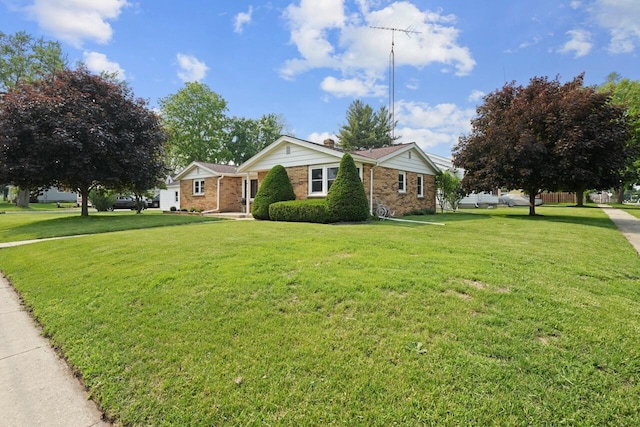 324 E Market St, Burlington, WI 53105 - single story home featuring a front lawn and brick siding