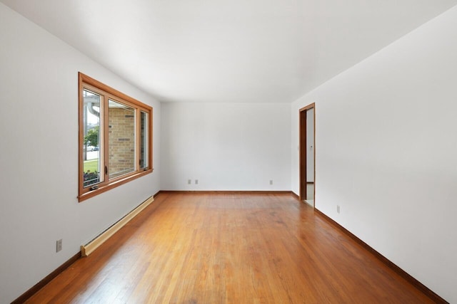 324 E Market St, Burlington, WI 53105 - unfurnished room featuring baseboard heating and light wood-style flooring