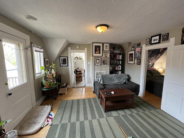 2928 N Humboldt Blvd Unit 2930, Milwaukee, WI 53212 - living room featuring a textured ceiling and light wood-style floors