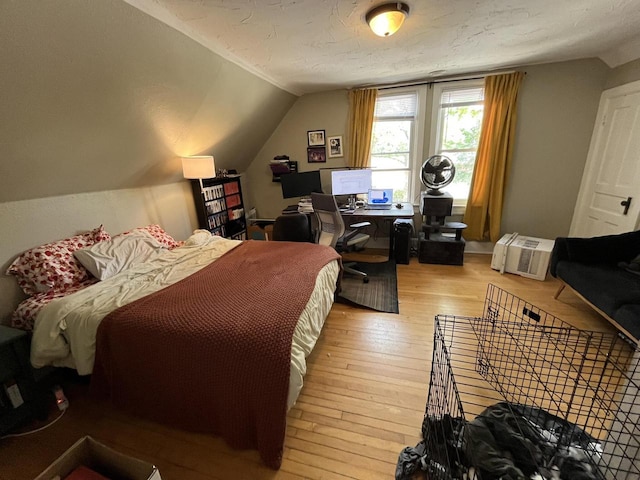 2928 N Humboldt Blvd Unit 2930, Milwaukee, WI 53212 - bedroom with light wood-style floors, a desk, and lofted ceiling