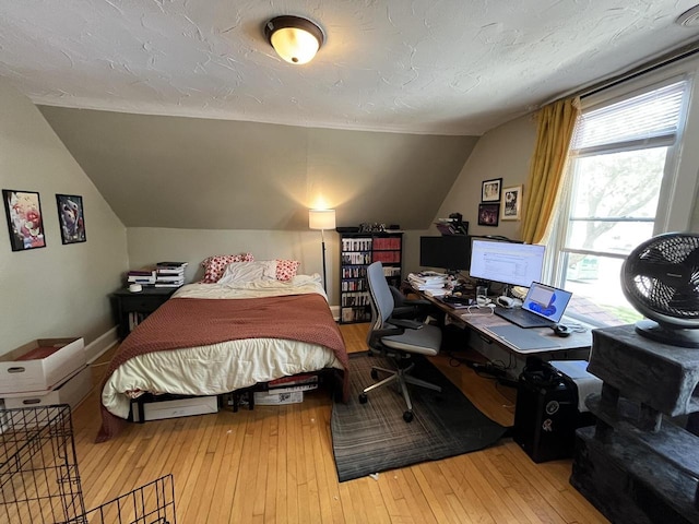 2928 N Humboldt Blvd Unit 2930, Milwaukee, WI 53212 - bedroom with lofted ceiling, light wood finished floors, and an office area