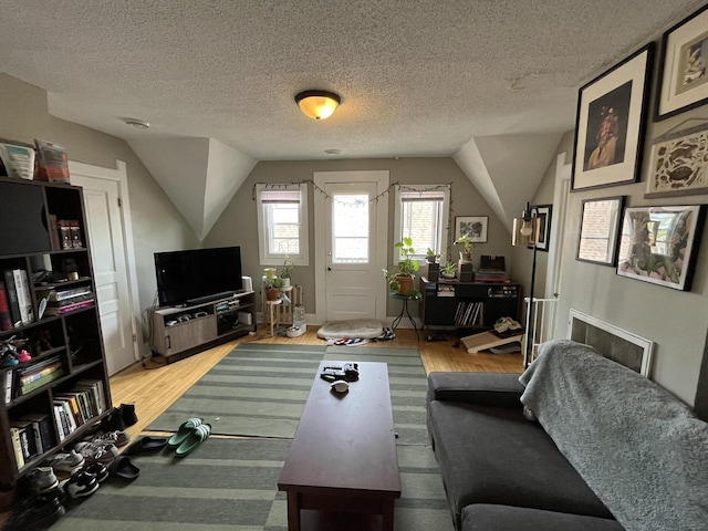 2928 N Humboldt Blvd Unit 2930, Milwaukee, WI 53212 - living area with vaulted ceiling, wood finished floors, and a textured ceiling