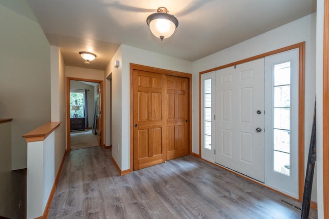 431 Thurow Dr, Oconomowoc, WI 53066 - entrance foyer with wood finished floors and baseboards