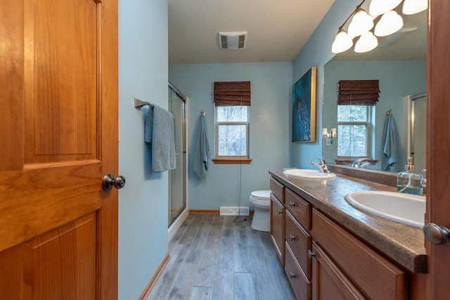 431 Thurow Dr, Oconomowoc, WI 53066 - full bath featuring wood finished floors, a stall shower, and double vanity