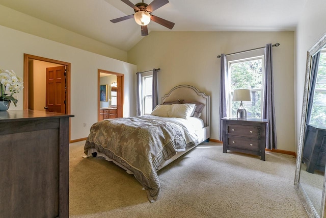 431 Thurow Dr, Oconomowoc, WI 53066 - bedroom featuring lofted ceiling, light colored carpet, connected bathroom, and a ceiling fan