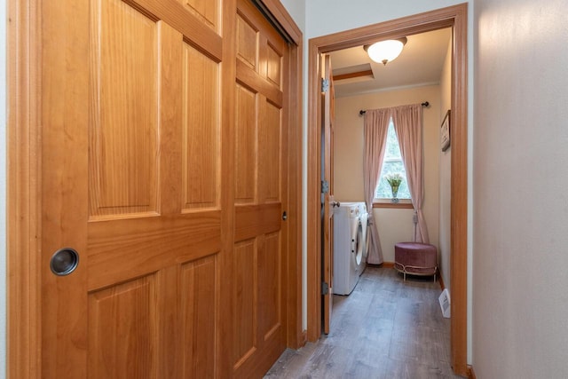 431 Thurow Dr, Oconomowoc, WI 53066 - hall with separate washer and dryer, wood finished floors, and ornamental molding