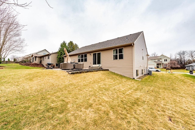 431 Thurow Dr, Oconomowoc, WI 53066 - back of house featuring a lawn and a patio