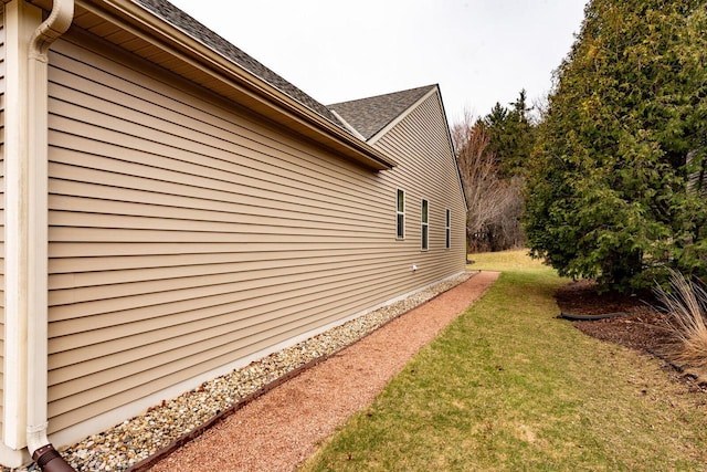 431 Thurow Dr, Oconomowoc, WI 53066 - view of side of home featuring a yard and a shingled roof