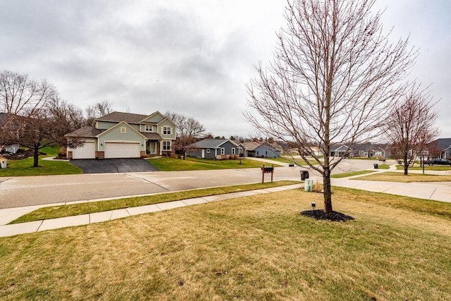 431 Thurow Dr, Oconomowoc, WI 53066 - view of green lawn with asphalt driveway, a residential view, and a garage