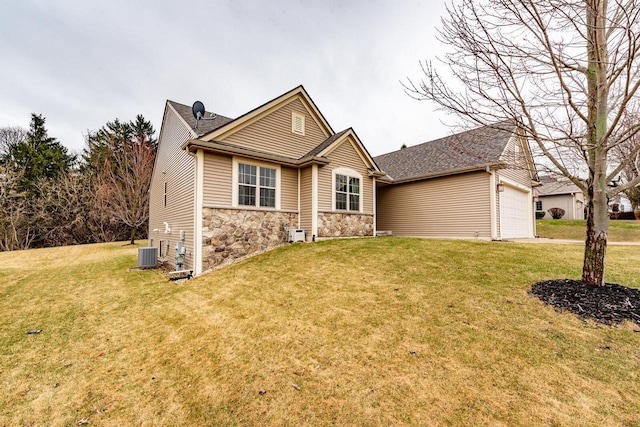 431 Thurow Dr, Oconomowoc, WI 53066 - single story home featuring stone siding, a front lawn, a garage, and driveway