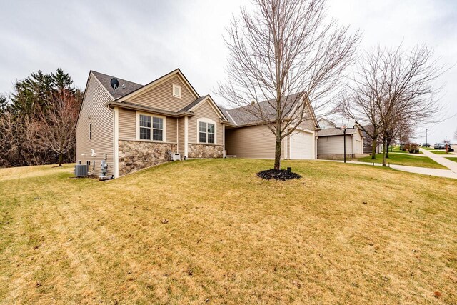 431 Thurow Dr, Oconomowoc, WI 53066 - single story home featuring stone siding, a front yard, and a garage