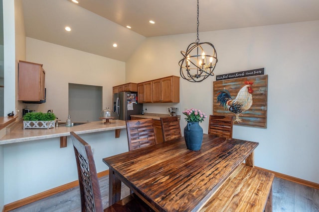 431 Thurow Dr, Oconomowoc, WI 53066 - dining room with a chandelier, wood finished floors, recessed lighting, and high vaulted ceiling