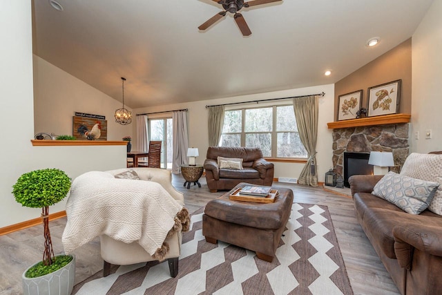 431 Thurow Dr, Oconomowoc, WI 53066 - living room featuring vaulted ceiling, healthy amount of natural light, ceiling fan, wood finished floors, and a fireplace