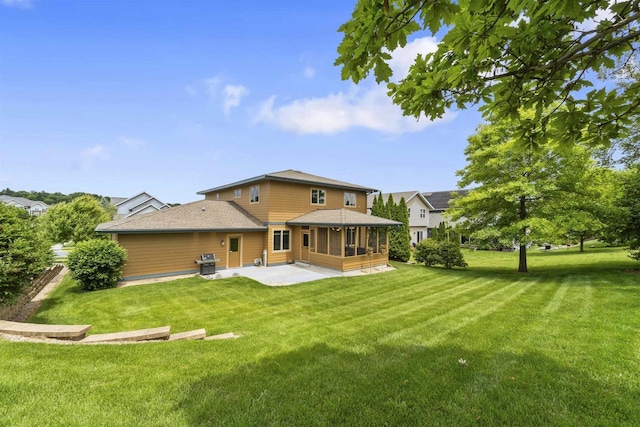 7131 Caneel Trl, Middleton, WI 53562 - rear view of house featuring a patio area, a lawn, a sunroom, and a shingled roof