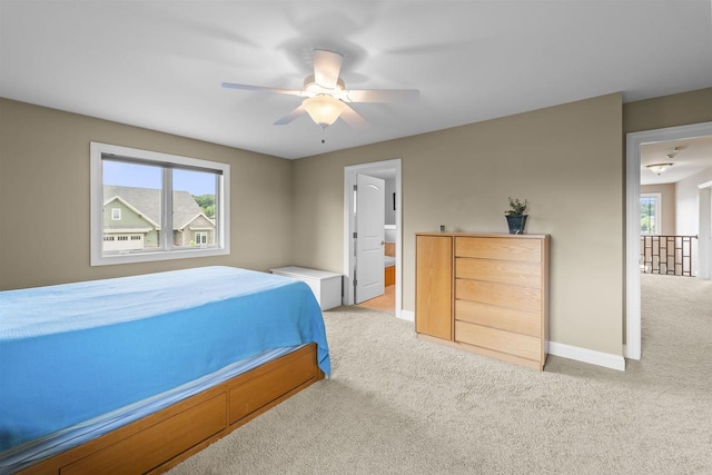 7131 Caneel Trl, Middleton, WI 53562 - carpeted bedroom with multiple windows and ceiling fan