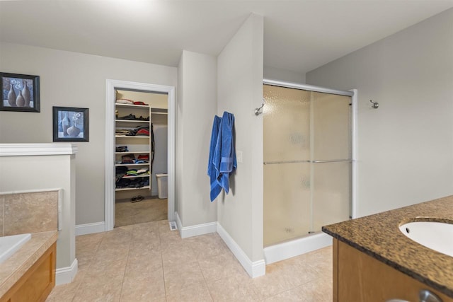 7131 Caneel Trl, Middleton, WI 53562 - full bathroom with a shower stall, vanity, a garden tub, and a spacious closet