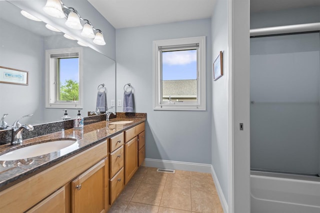 7131 Caneel Trl, Middleton, WI 53562 - bathroom featuring double vanity, tile patterned flooring, and washtub / shower combination