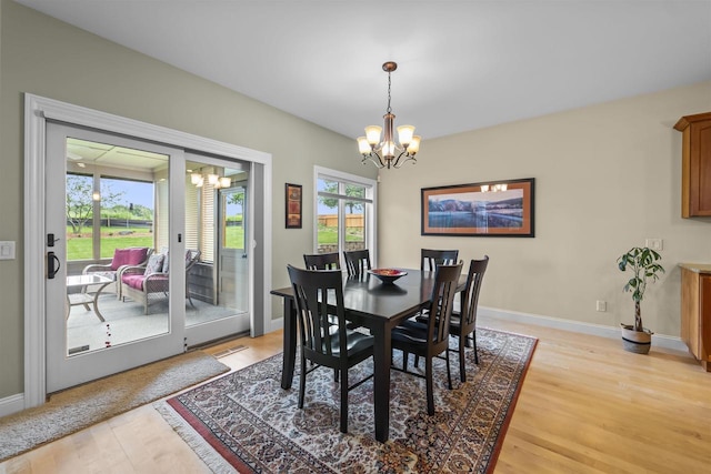 7131 Caneel Trl, Middleton, WI 53562 - dining space with a chandelier, healthy amount of natural light, and light wood finished floors