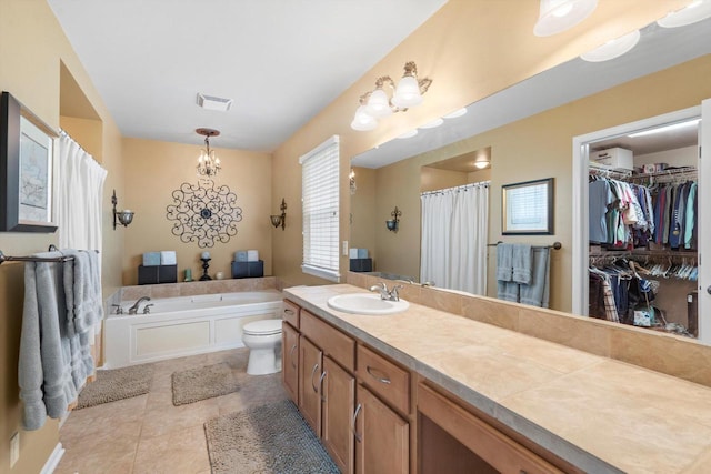 3259 Emmertsen Rd, Racine, WI 53406 - bathroom featuring a garden tub, vanity, tile patterned flooring, a spacious closet, and curtained shower