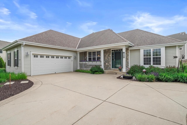 3259 Emmertsen Rd, Racine, WI 53406 - view of front of property with concrete driveway, a porch, an attached garage, and roof with shingles