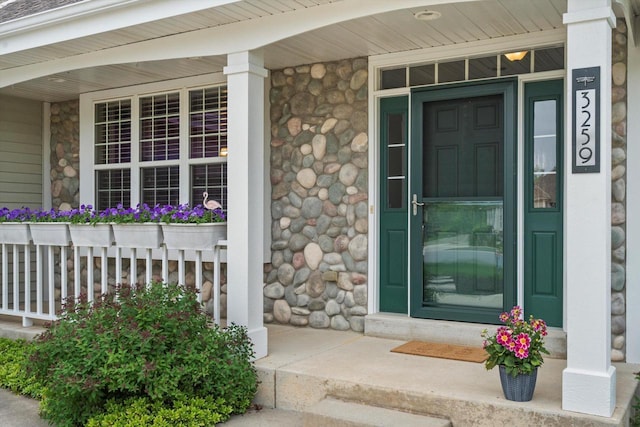 3259 Emmertsen Rd, Racine, WI 53406 - property entrance featuring covered porch and stone siding